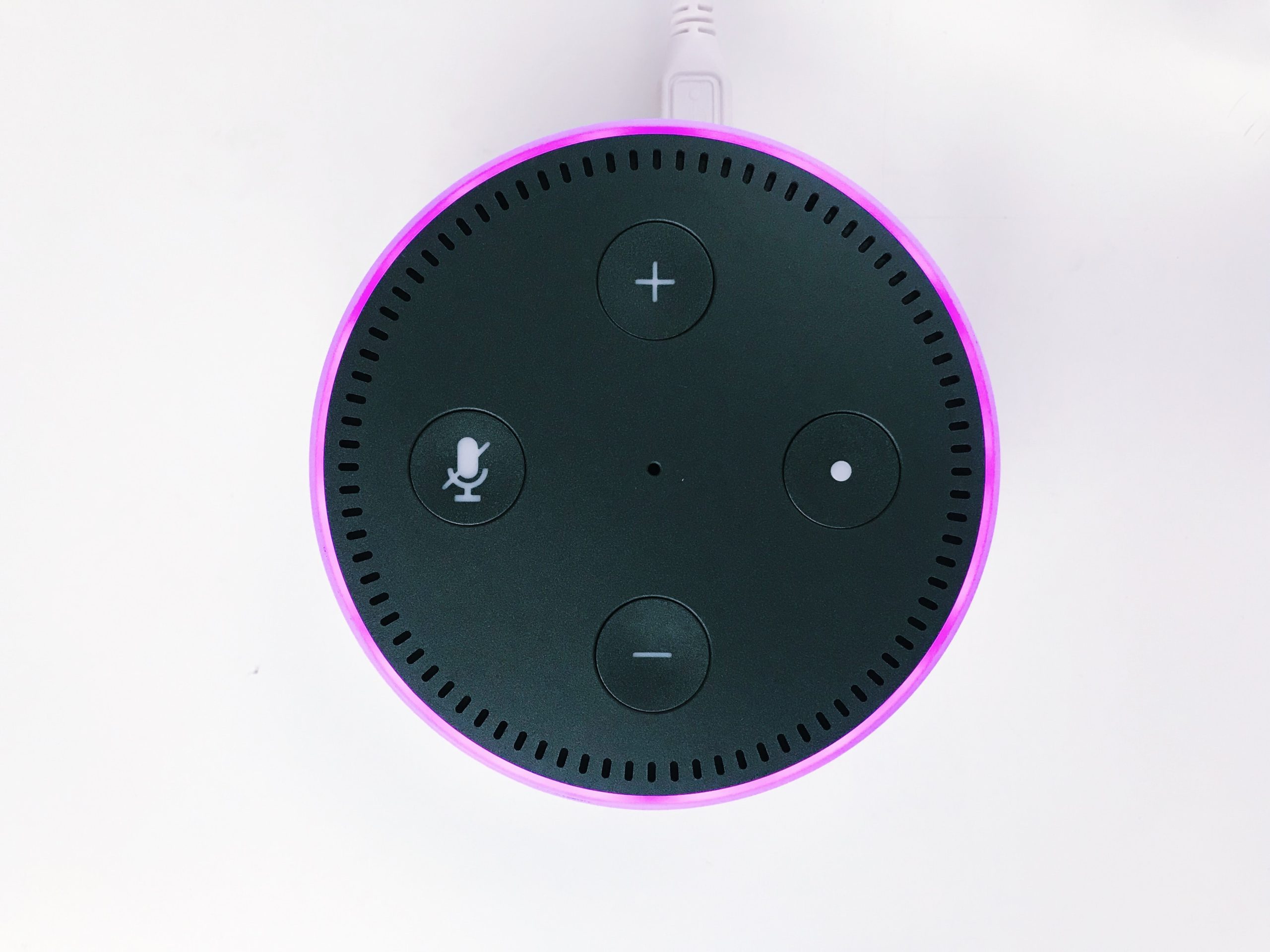 top view of an amazon echo with magenta light