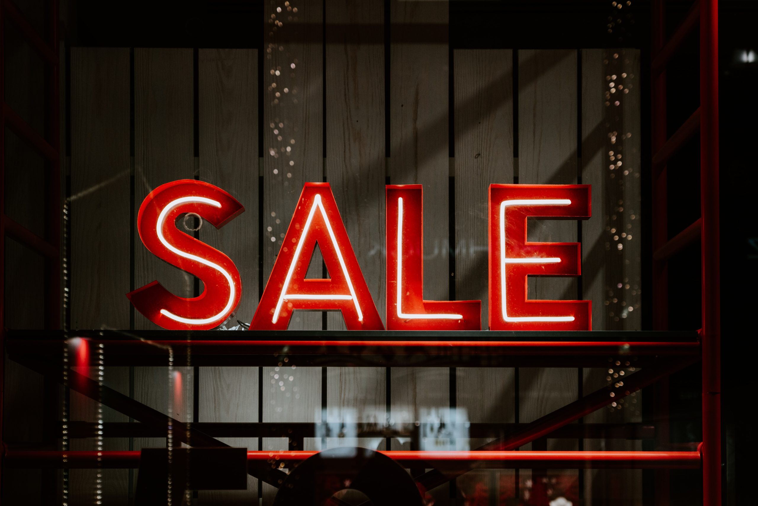 metal and neon red sale sign
