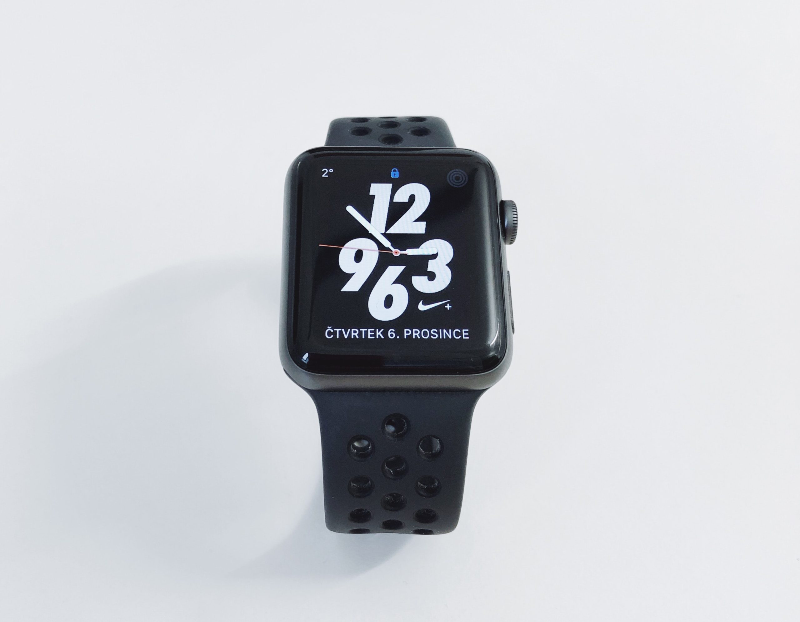 black smart watch with large numbers for 12, 3, 6, and 9